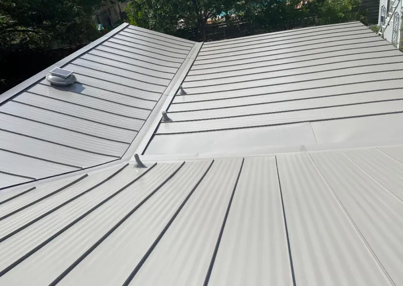 Solar attic fan installed on a metal roof for Roof Ventilation in Crescent City